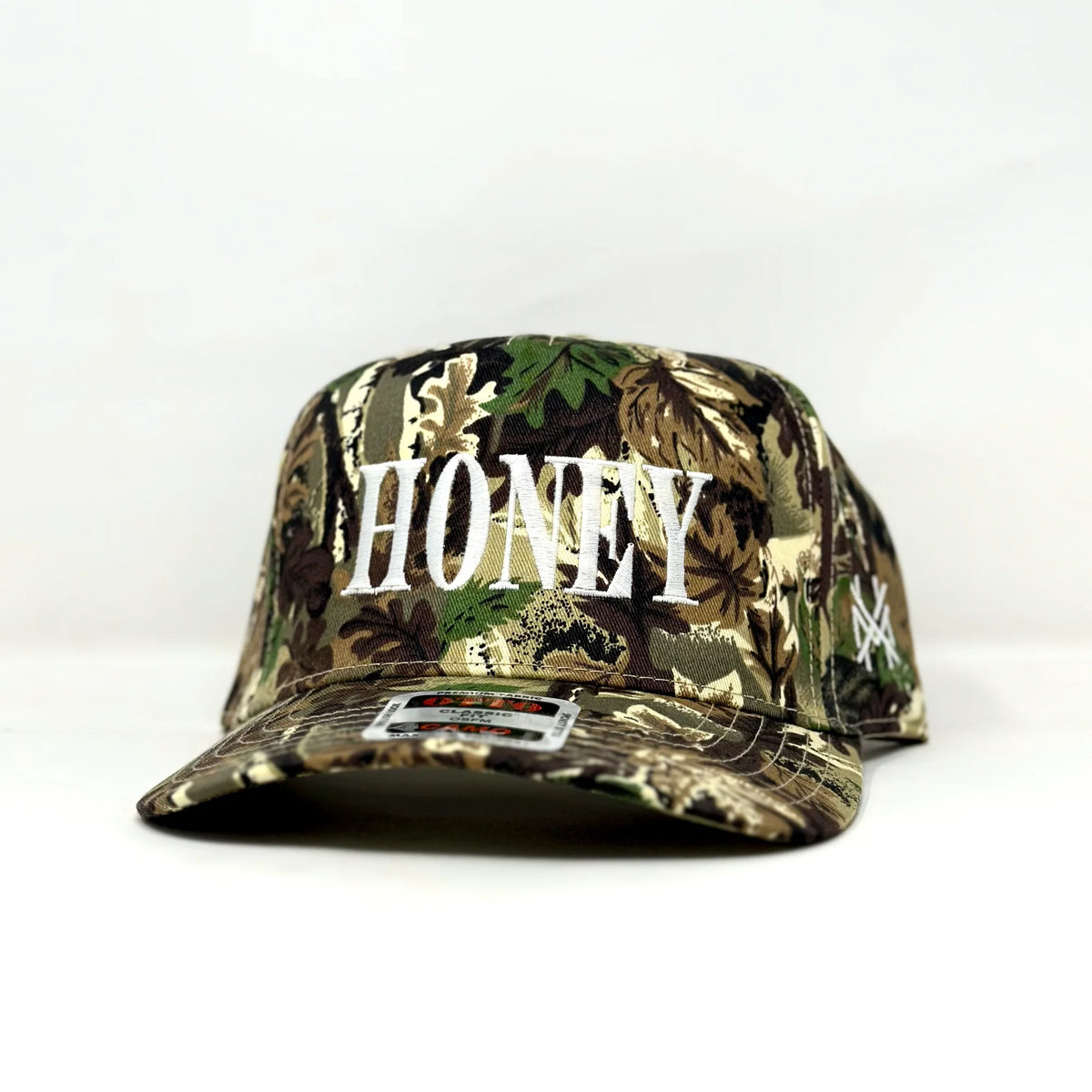 HONEY Trucker Hat in Camo